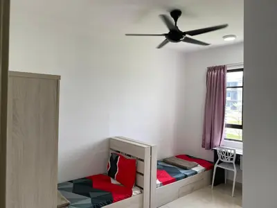 a bedroom with a bed with a ceiling fan at Meadow Park (1331 Sweet Home) in Kampong Malim Nawar