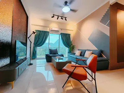 a living room with a couch and a tv at INS Pavillion by irainbow in Ipoh