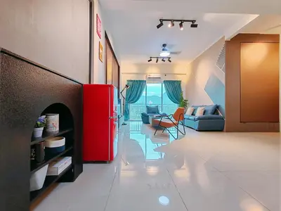 a living room with a red refrigerator in a room at INS Pavillion by irainbow in Ipoh