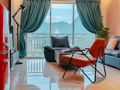a living room with a couch and a table at INS Pavillion by irainbow in Ipoh