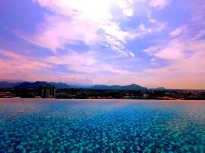 a large body of water with a city in the background at The Horizon Ipoh Dual L13 by Grab A Stay in Ipoh