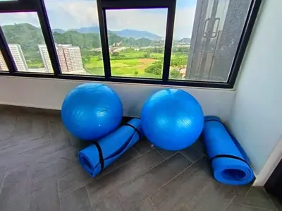 a room with blue chairs in front of a window at The Horizon Ipoh Dual L13 by Grab A Stay in Ipoh