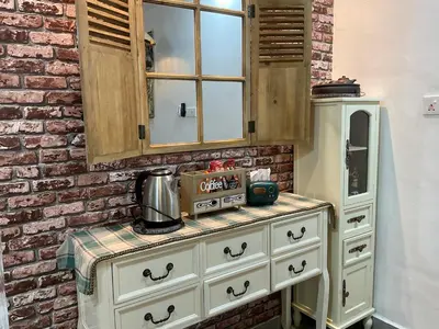 a kitchen with a cabinet and a counter top at Jessie Home in Bukit Mertajam