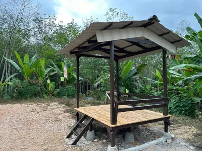 a picnic table with a roof on top of it at D’Asam Homestay Baling in Baling