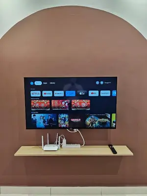 a large flat screen tv on a wall at Air-home No 28 Simpang near Aulong Econsave, 3BR, 7pax, Netflix in Simpang
