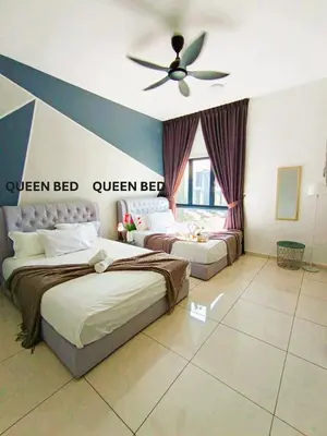 a bedroom with two beds and a ceiling fan at The Horizon Ipoh Dual L12 by Grab A Stay in Ipoh