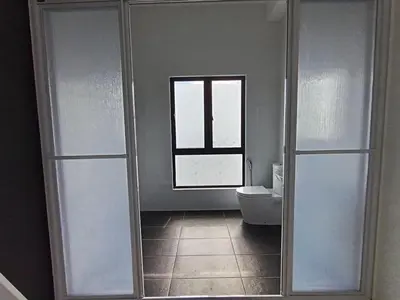 a bathroom with a toilet and a window at The Horizon Ipoh Dual L12 by Grab A Stay in Ipoh