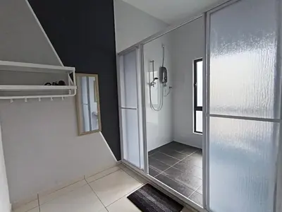 a bathroom with a walk in shower and a glass door at The Horizon Ipoh Dual L12 by Grab A Stay in Ipoh