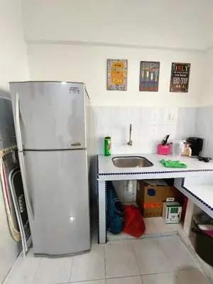 a kitchen with a stainless steel refrigerator and a sink at EC14-Georgetown-3room-PrivateHouse in George Town