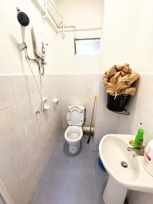 a white bathroom with a toilet and a sink at EC14-Georgetown-3room-PrivateHouse in George Town