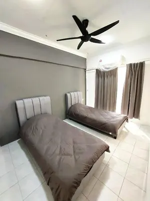 two beds in a room with a ceiling fan at EC14-Georgetown-3room-PrivateHouse in George Town