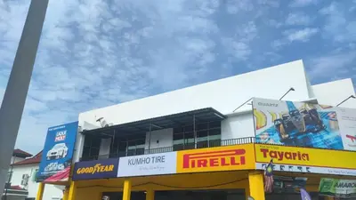 a building with a truck on top of it at Happy homestay in Teluk Intan