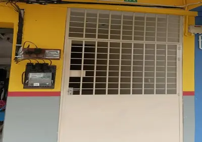 a white garage door with a bunch of windows at Happy homestay in Teluk Intan