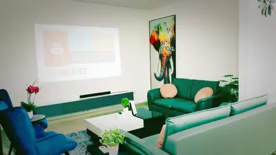 a living room with two blue couches and a table at Ipoh Urban Retreat 20PAX 5 Room Holiday Villa by City Home Empire in Ipoh