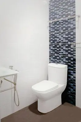a white bathroom with a toilet and a sink at Ipoh Urban Retreat 20PAX 5 Room Holiday Villa by City Home Empire in Ipoh
