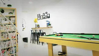 a room with a pool table and some chairs at Ipoh Urban Retreat 20PAX 5 Room Holiday Villa by City Home Empire in Ipoh