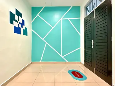 a room with a door and a red dog rug at Ipoh IGB Homestay by Comfort Home in Ipoh