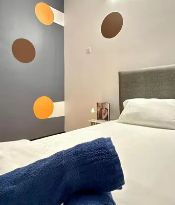 a bedroom with a bed with a blue blanket on it at Ipoh IGB Homestay by Comfort Home in Ipoh