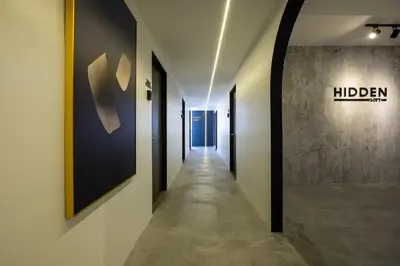 a corridor of a hallway with a sign on the wall at Boutique Hidden loft in Bukit Mertajam