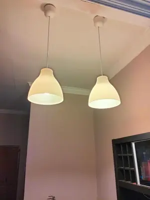two lights hanging from the ceiling in a room at De'Lakeside musslim's homestay in Raub