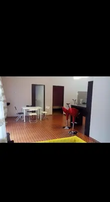 a room with a table and chairs and a table and a table and chairs at De'Lakeside musslim's homestay in Raub