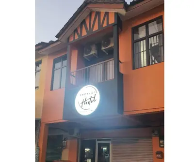 a building with a sign on the side of it at ShopLot Hostel Pangkor in Pasir Bogak
