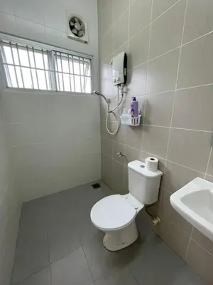 a bathroom with a toilet and a sink at Eyu Sweet Home in Sitiawan 10-13 pax free wifi in Sitiawan