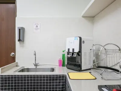 a kitchen with a sink and a coffee maker on a counter at Cheerful Guesthouse #Adventist#BudgetStay in George Town