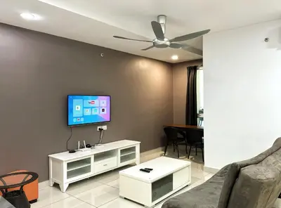a living room with a flat screen tv on a wall at Leisure 1Bedroom Balcony Suites Gurney in George Town