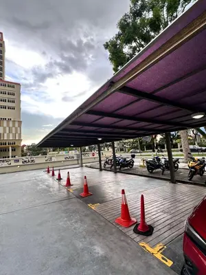 a group of orange cones on a parking lot at Leisure 1Bedroom Balcony Suites Gurney in George Town