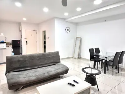 a living room with a couch and a table at Leisure 1Bedroom Balcony Suites Gurney in George Town