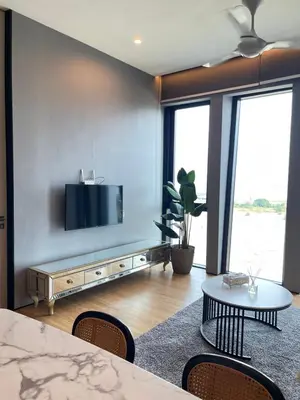 a living room with a flat screen tv on a wall at Penang Amazing SeaView Private Lift \u68b9\u57ce\u5bcc\u4eba\u533a\u7edd\u7f8e\u6d77\u666f\u516c\u5bd3\u79c1\u4eba\u7535\u68af in Tanjong Tokong