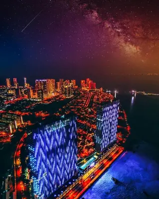 a view of a city at night with blue lights at Penang Amazing SeaView Private Lift \u68b9\u57ce\u5bcc\u4eba\u533a\u7edd\u7f8e\u6d77\u666f\u516c\u5bd3\u79c1\u4eba\u7535\u68af in Tanjong Tokong