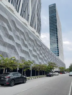 a large building with cars parked on a street at Penang Amazing SeaView Private Lift \u68b9\u57ce\u5bcc\u4eba\u533a\u7edd\u7f8e\u6d77\u666f\u516c\u5bd3\u79c1\u4eba\u7535\u68af in Tanjong Tokong