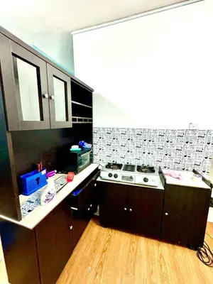 a kitchen with a stove and a counter top at COZY, FAMILYSTAY, BAYAN LEPAS, only 4pax, 1car parking in Bayan Lepas