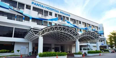 a hospital building with a white and blue building at COZY, FAMILYSTAY, BAYAN LEPAS, only 4pax, 1car parking in Bayan Lepas