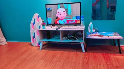 a desk with a mirror and a surfboard in a room at COZY, FAMILYSTAY, BAYAN LEPAS, only 4pax, 1car parking in Bayan Lepas