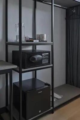 a black shelf with a microwave and a blender at Macalister 288 in George Town