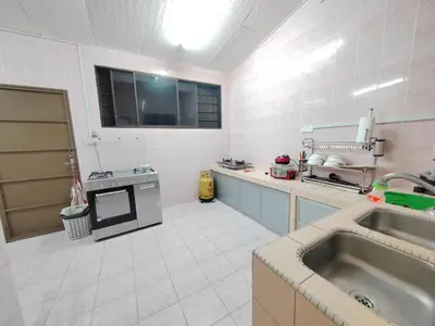 a large kitchen with a sink and a stove at Ipoh Station 18 Homestay in Ipoh