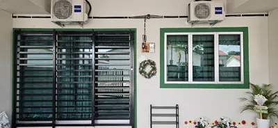 a house with a green and white door and a window at Teluk Intan Homestay Landed 3BR2B in Teluk Intan