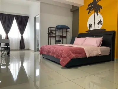 a bedroom with a bed and a yellow and white wall at Sweet Homestay 1 The Venus Sitiawan in Sitiawan