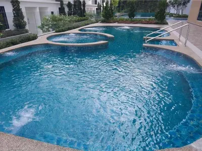 a large pool with blue water in a building at Hotspring 2 Room Suite @ Sunway Onsen with Theme Park View 4 to 6 pax in Tambun