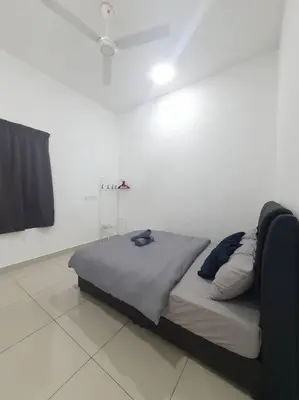 a bed sitting in a white room with at Southbay Seaview Condo A16 #10minQueensbay #15minSPICE in Bayan Lepas