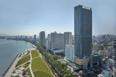 a city skyline with a tall building and a river at Penang Marriott Hotel in George Town