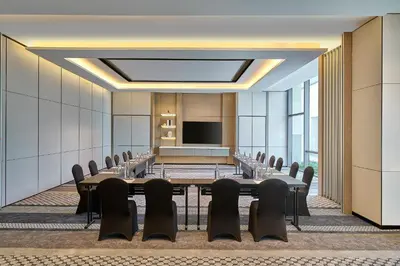 a conference room with a long table and chairs at Penang Marriott Hotel in George Town