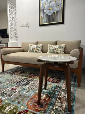 a living room with a couch and a coffee table at Tiny House PT82 Kg Gumut Tambahan in Kalumpang