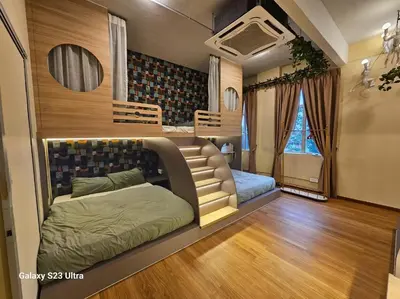 a room with a couch and a bed in it at Lumina Stay @ Kampar 16 pax in Kampar