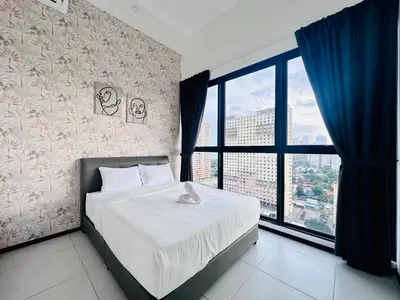 a bedroom with a bed and a large window at New 2BR or 3BR Homey Getaway stay 7 to 10 pax at Urban Suites, Georgetown by URBAN STAYCATION LOD COSY in Jelutong