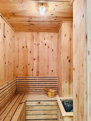 a sauna with wooden walls and a wooden floor at New 2BR OR 3BR Cityview Homestay at Urban Suite BY URBAN STAYCATION LDL in Jelutong
