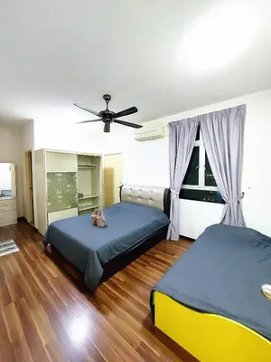 a bedroom with two beds and a ceiling fan at TuR15 PisaStadium 9pax 4rooms PrivateHouse in Bayan Lepas
